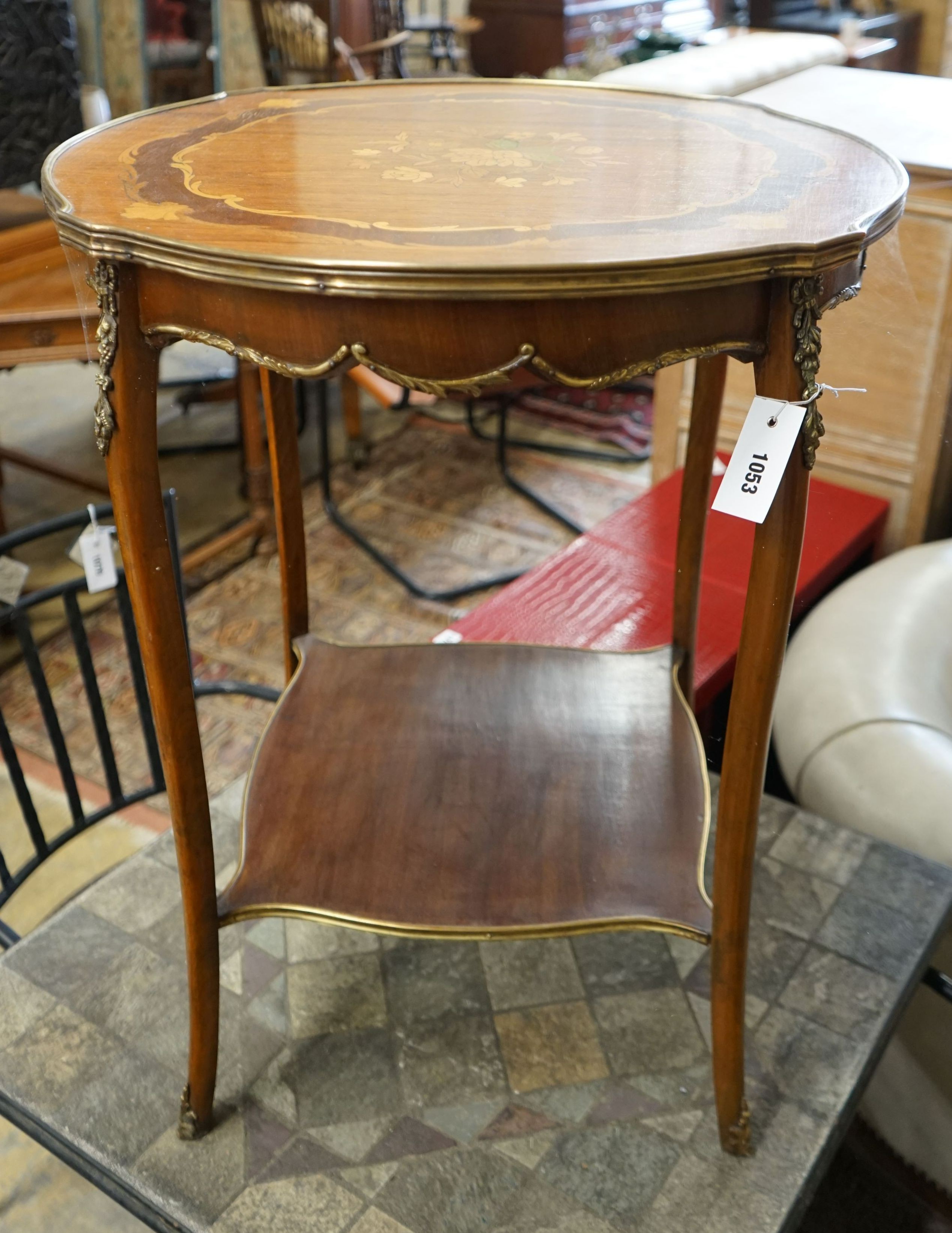 A Louis XVI style circular gilt metal mounted marquetry inlaid circular kingwood centre table, diameter 57cm, height 72cm